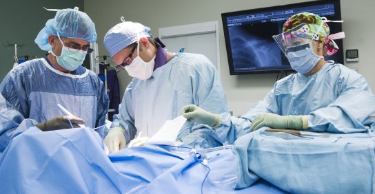 Three surgeons during a surgery
