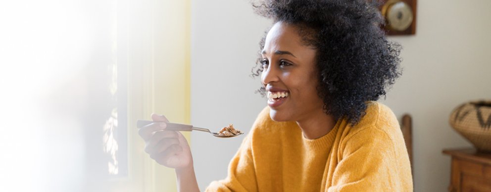Image of woman eating cereal 